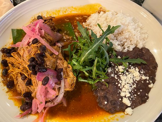 Meso Maya Comida Y Copas signature dishes Cochinita PibilBudin Azteca (corn tortilla pie)Carne Asada